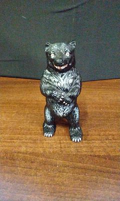 A Cast Iron Still Bank in the Form of a Standing Black Bear. A single figural coin bank, likely 