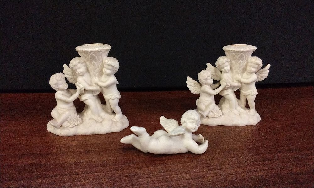 Lot 500: Three Off-White Ceramic Cherub Christmas Candle Holders and Figurine