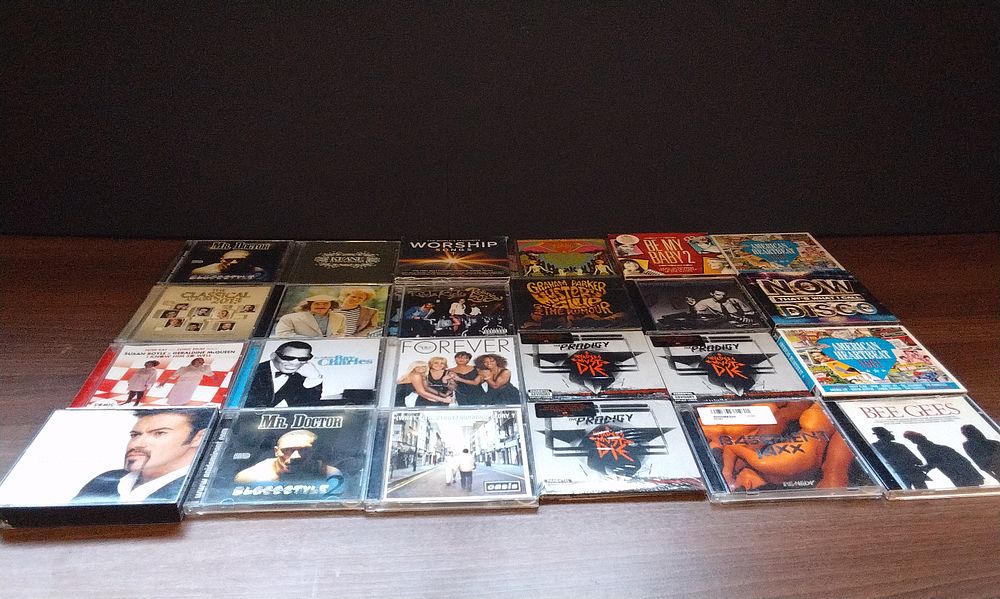 Lot 551: A Collection of 24 Music CD Albums.