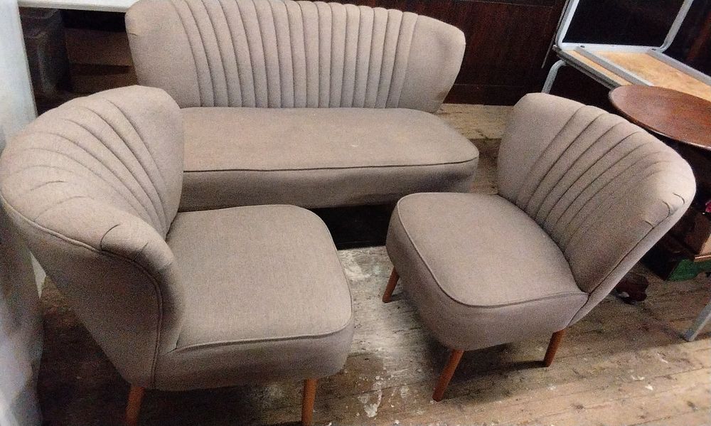 Lot 583: A Trio of Mid-Century Channel-Tufted Sofa and Armchairs