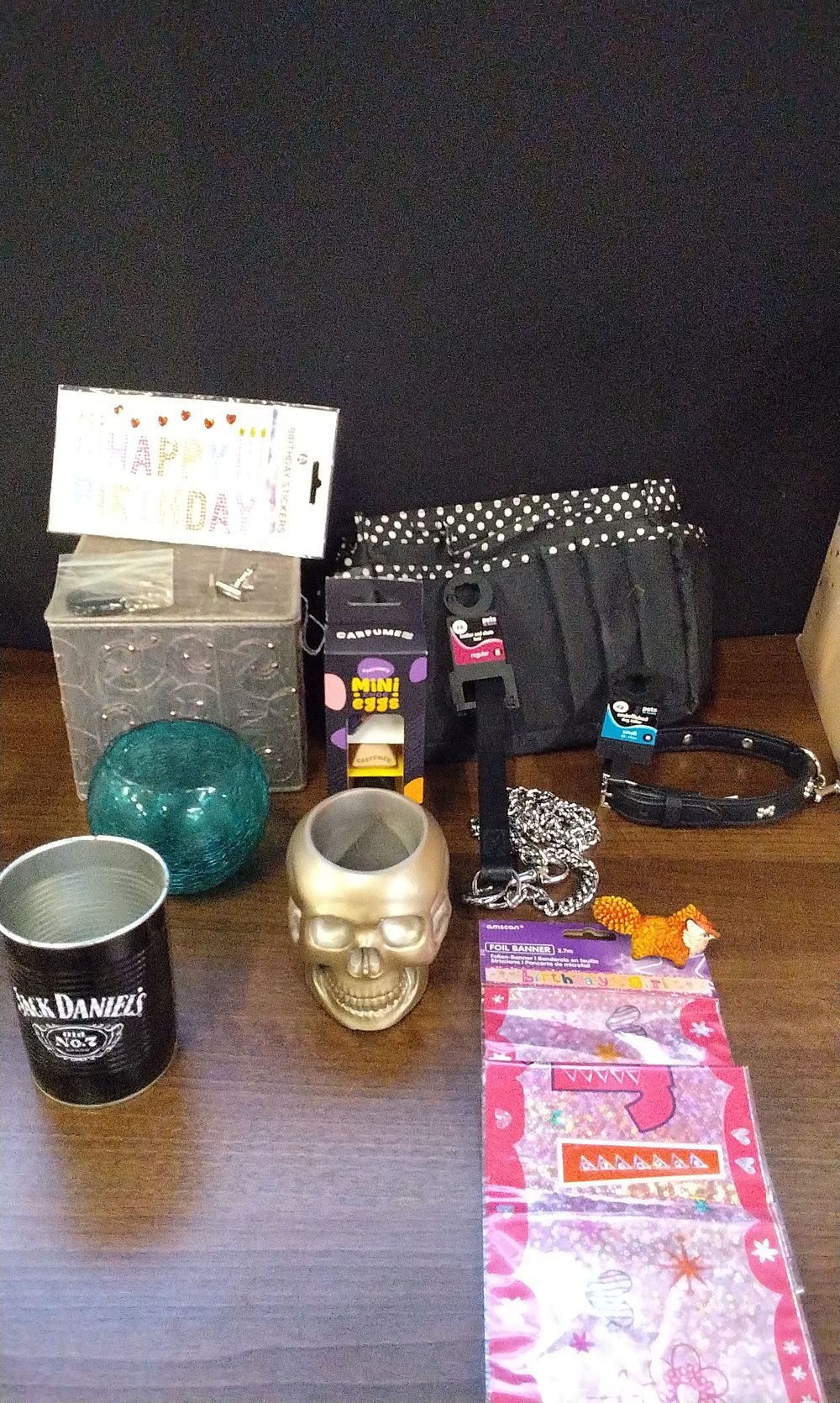 Lot 592: A Collection of Mixed Goods Including Jack Daniel's Tin and Skull Decor