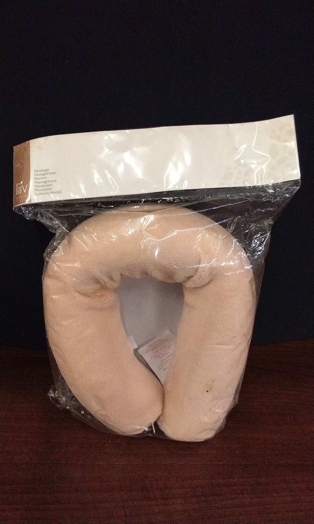 Lot 594: Liiv Brand Light Beige U-Shaped Massaging Neck Pillow. New in Packaging