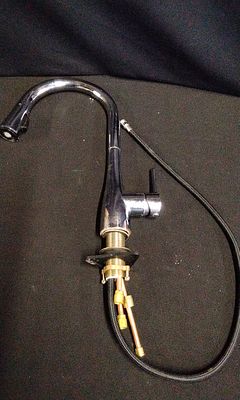 WATERSMITH Chrome Single Handle Pull Down Kitchen Faucet. A single silver/chrome single-handle 