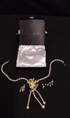 Three-Piece Faux Pearl Rhinestone Starburst Jewelry Set. A three-piece white faux pearl and 