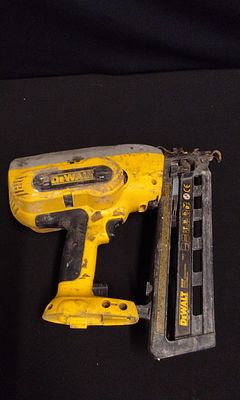 DEWALT DC610 Type 1 Cordless Yellow and Black Nail Gun. . A dusty yellow and black DEWALT 