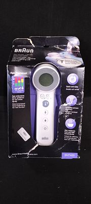 Braun BNT400 No Touch + Touch Forehead Thermometer. A single packaged black and white BRAUN 
