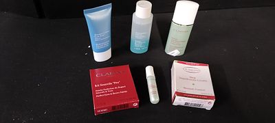 A Collection of Six Clarins Skincare and Makeup Products. A collection of six Clarins Paris 