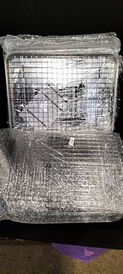 A Collection of Six Baking Tray and Cooling Rack Sets. A collection of six new metallic baking 