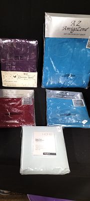 A Collection of Five Packaged Easy Care Bedding Items. A collection of five packaged bedding 