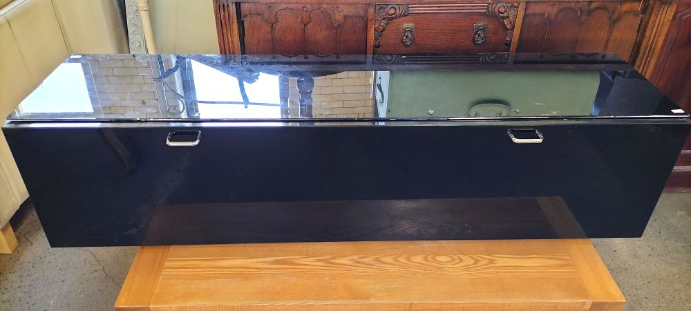 Lot 639: A Black Mirrored Floating Wall Storage Cabinet with a Glass Top
