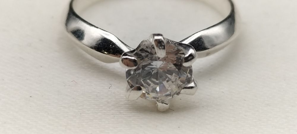 Lot 643: Silver & Clear Stoned Ring, Size J/K Stamped 925