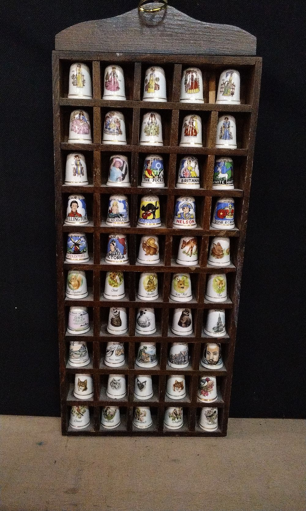Lot 267: 50 Porcelain Thimbles Housed In a Hanging Wooden Display