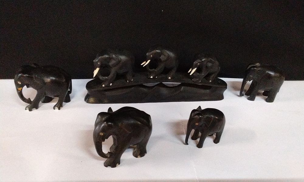 Lot 156: Vintage Ebony Wood Elephant Bridge Carving Set. and 4x Ebony Elephants