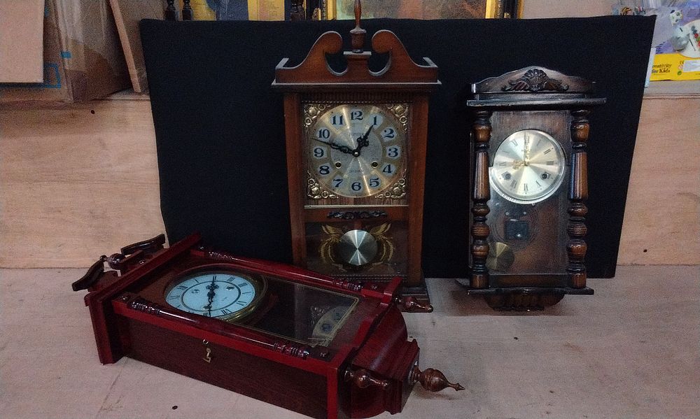 Lot 176: Three Wall Clocks in Wood Cases. Holly, Jupiter  and a Vienna Style Wall Clock. All with Thirty One Day Movements and Keys