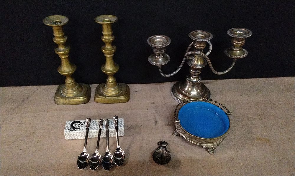 Lot 210: Pair of Brass Candlesticks,2 Arm Silver Plated Candleabra, Silver Plated Edwardian Gallery Butter Candy Dish Basket Holder with a Light Blue Glass Liner. 4 Teaspoons, and a Birmingham Hallmarked Silver Shell Shaped Caddy Tea spoon,  .