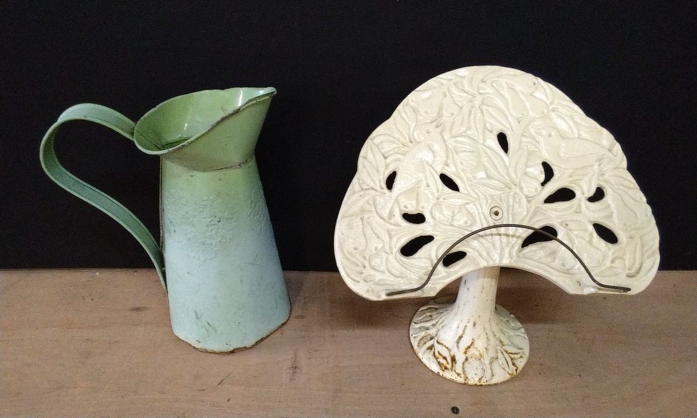 Lot 299: Cast Iron Book Rest and a Green Enamel Pitcher Jug.