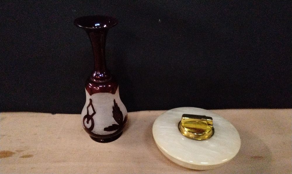 Lot 347: Vintage West German Table Lighter in a Mother Of Pearl Effect Flying Saucer Shape. And a Vintage Hand Blown Ruby and Opaque Glas Vase