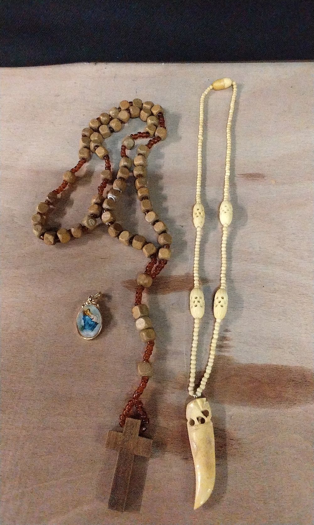 Lot 364: Wood and Beaded Rosary, Religious Pendant and a Bone Necklace
