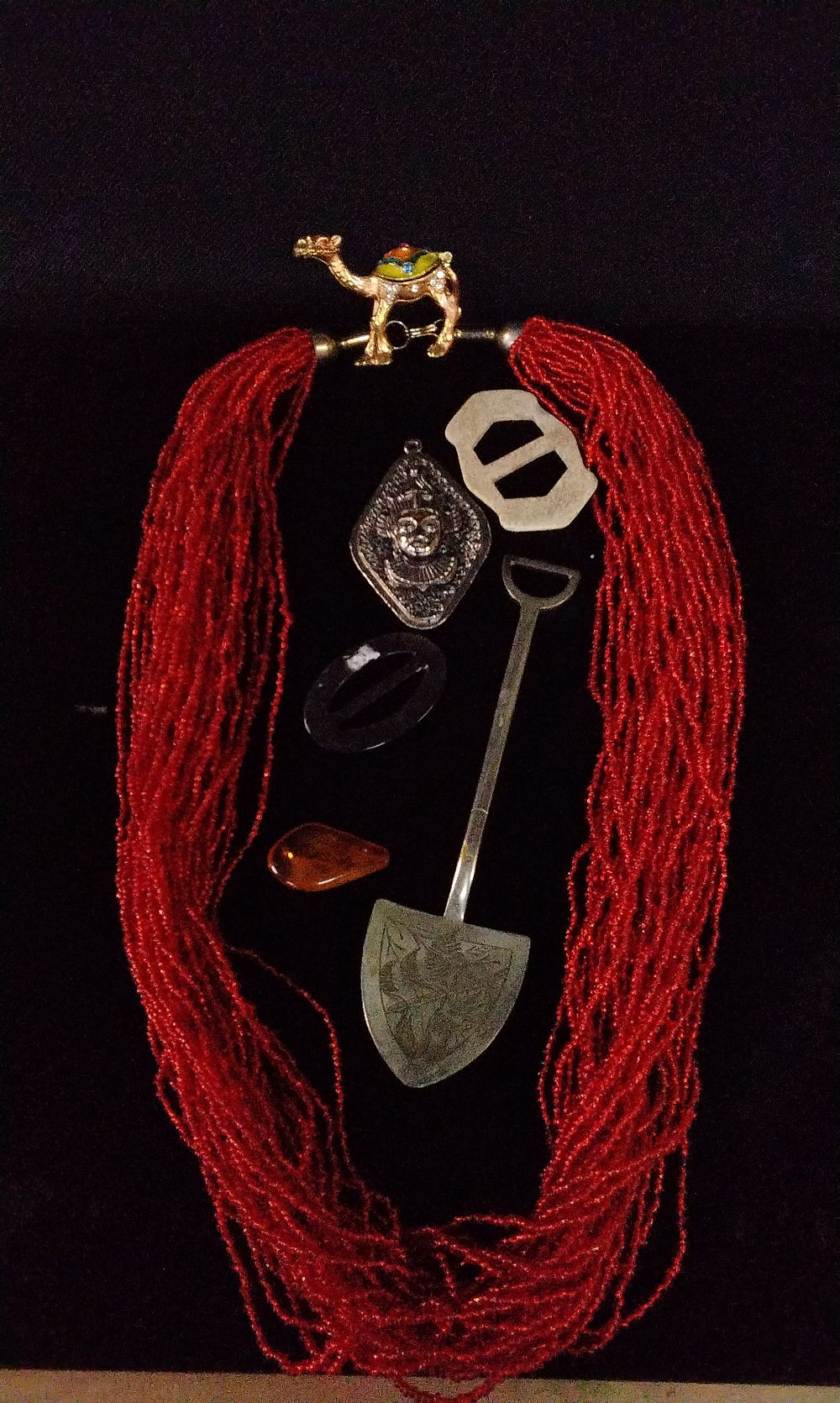 Lot 366: Red Beaded Necklace, EPNS shovel, Silver Coloured Pendant and Other Items