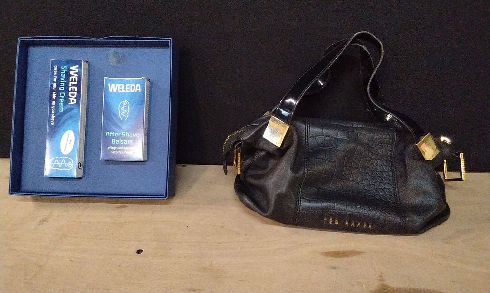 Lot 368: Ted Baker Two Way Black Leather Bag with Gold Coloured Hardware and a  Boxed Weleda Aftershave Balm and Shaving Cream Set