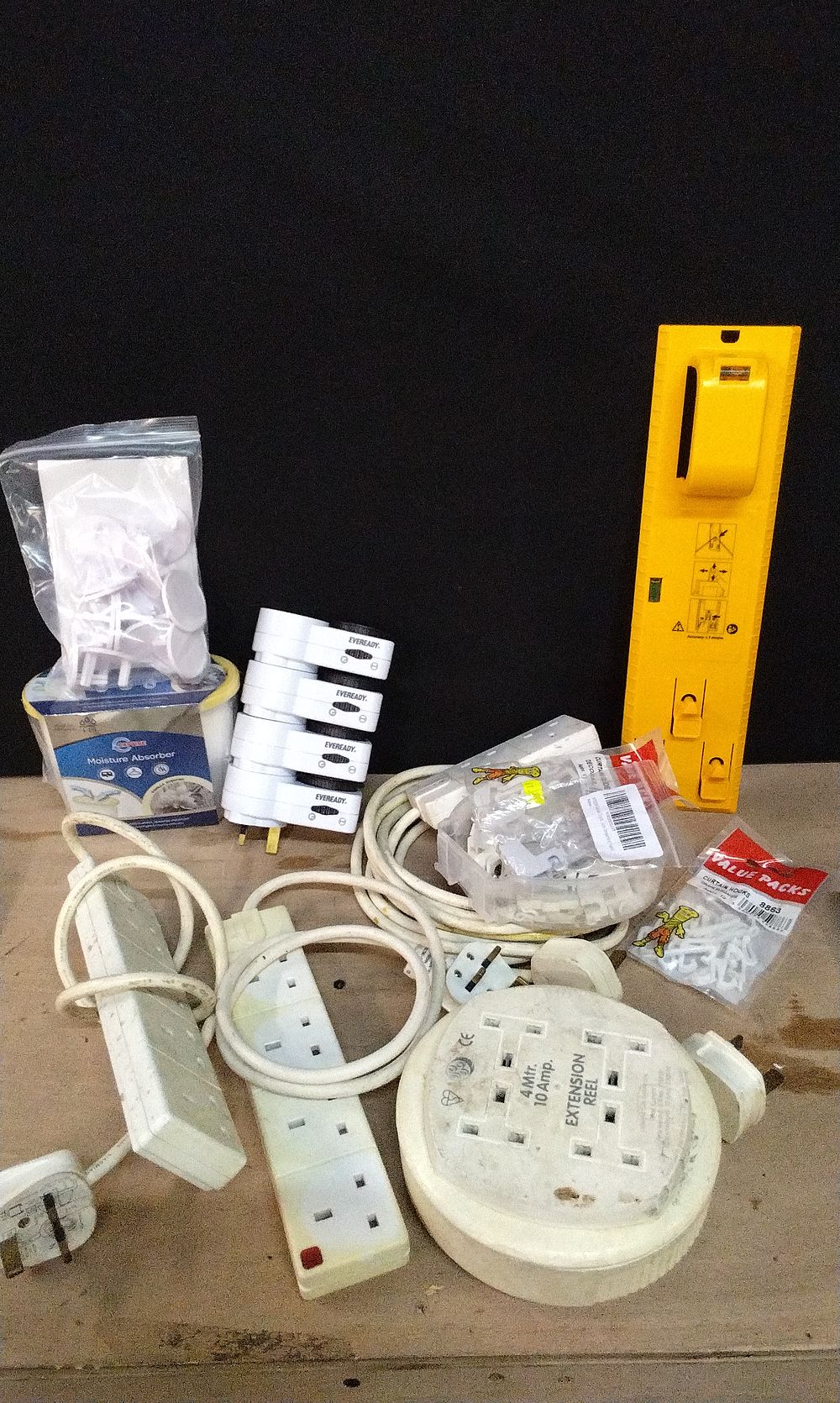 Lot 389: Box Containing Various Extension Leads, Child Safety plug Covers, and Other Items
