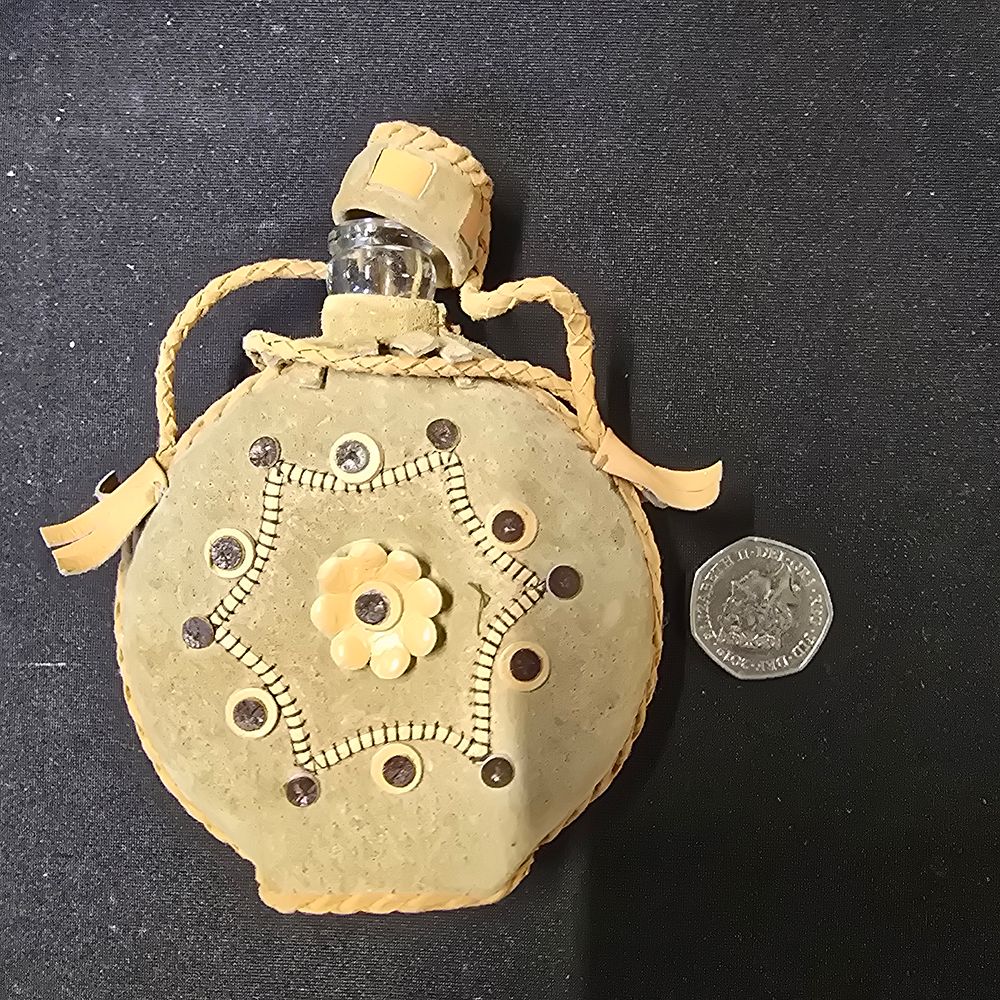 Lot 152: Vintage glass water bottle in leather case