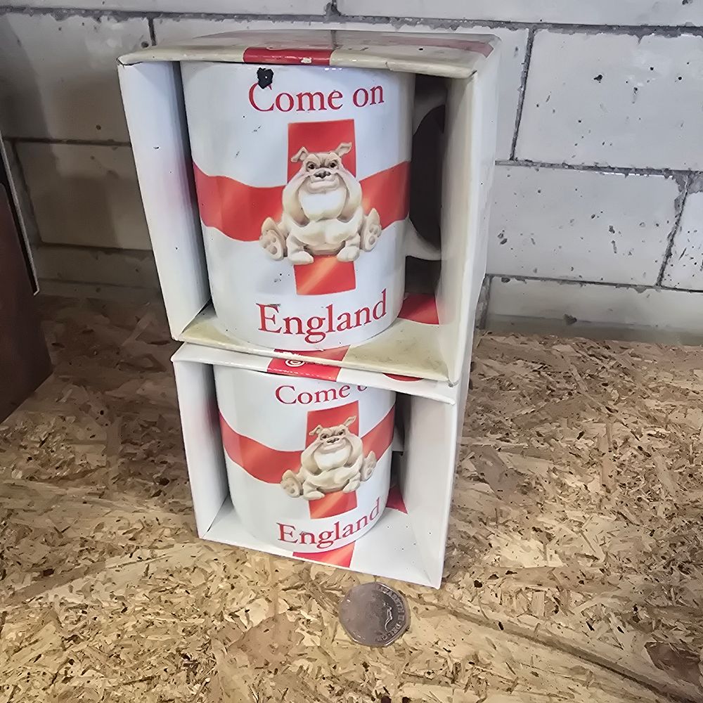 Lot 184: Two 2006 England mugs