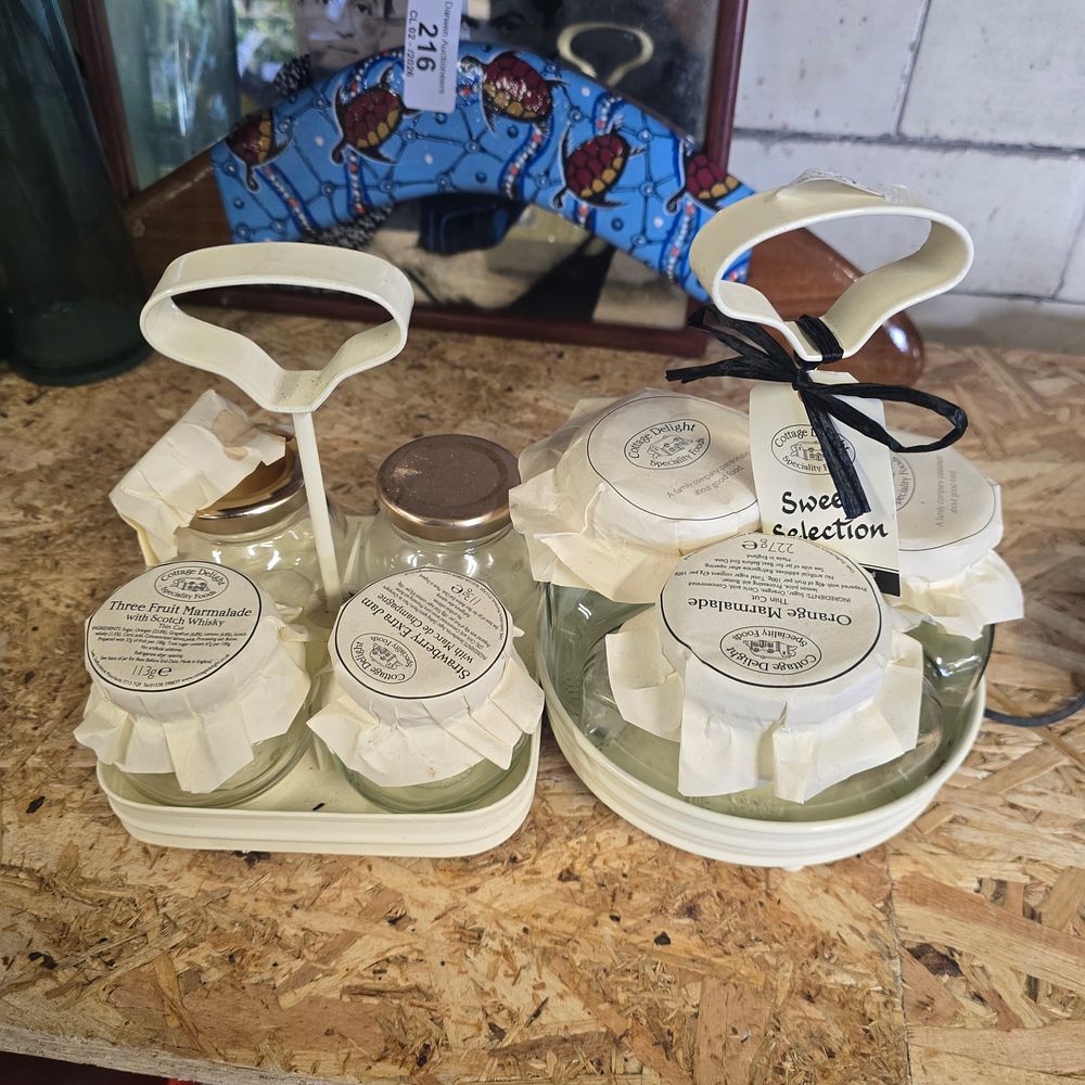 Lot 224: Two sets of cottage delights storage jars on trays