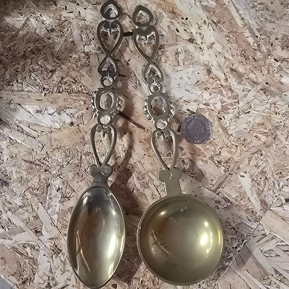 Lot 227: A pair of vintage brass spoons