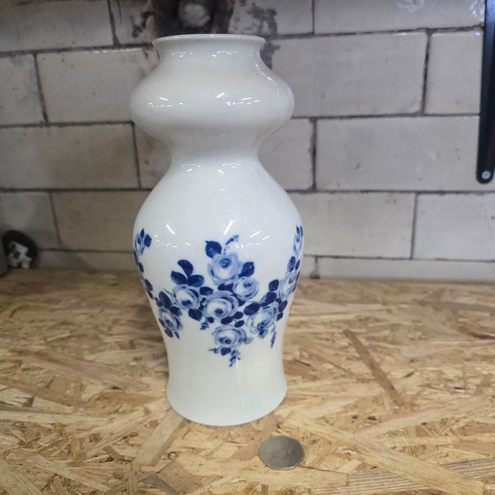 Lot 270: Vintage blue and white vase 24cm H