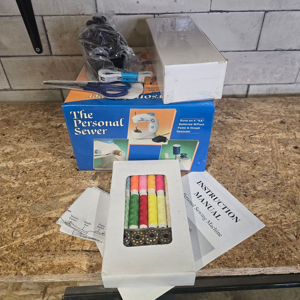 Lot 280: Vintage personal sewer and accessories