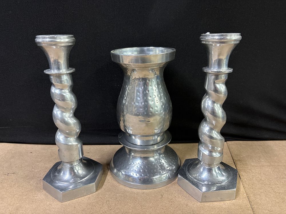 Lot 278: Three metal candle sticks and candle stand