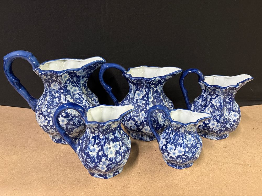 Lot 279: Five Graduated Burleigh Calico Pattern Staffordshire Ironstone Jugs