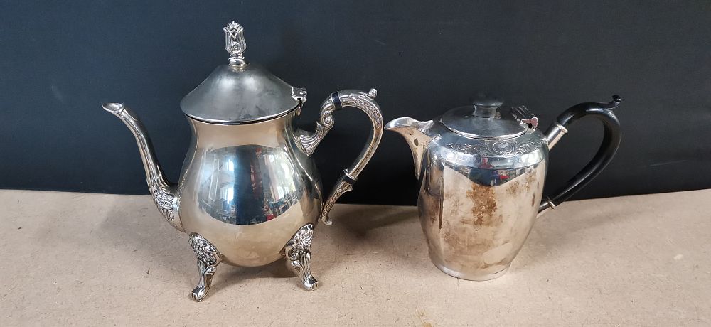 Lot 322: Two Silver Plated Teapots with Black Handles
