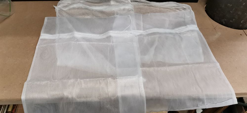 Lot 216: A Collection of White Mesh Laundry Bags with Zippers