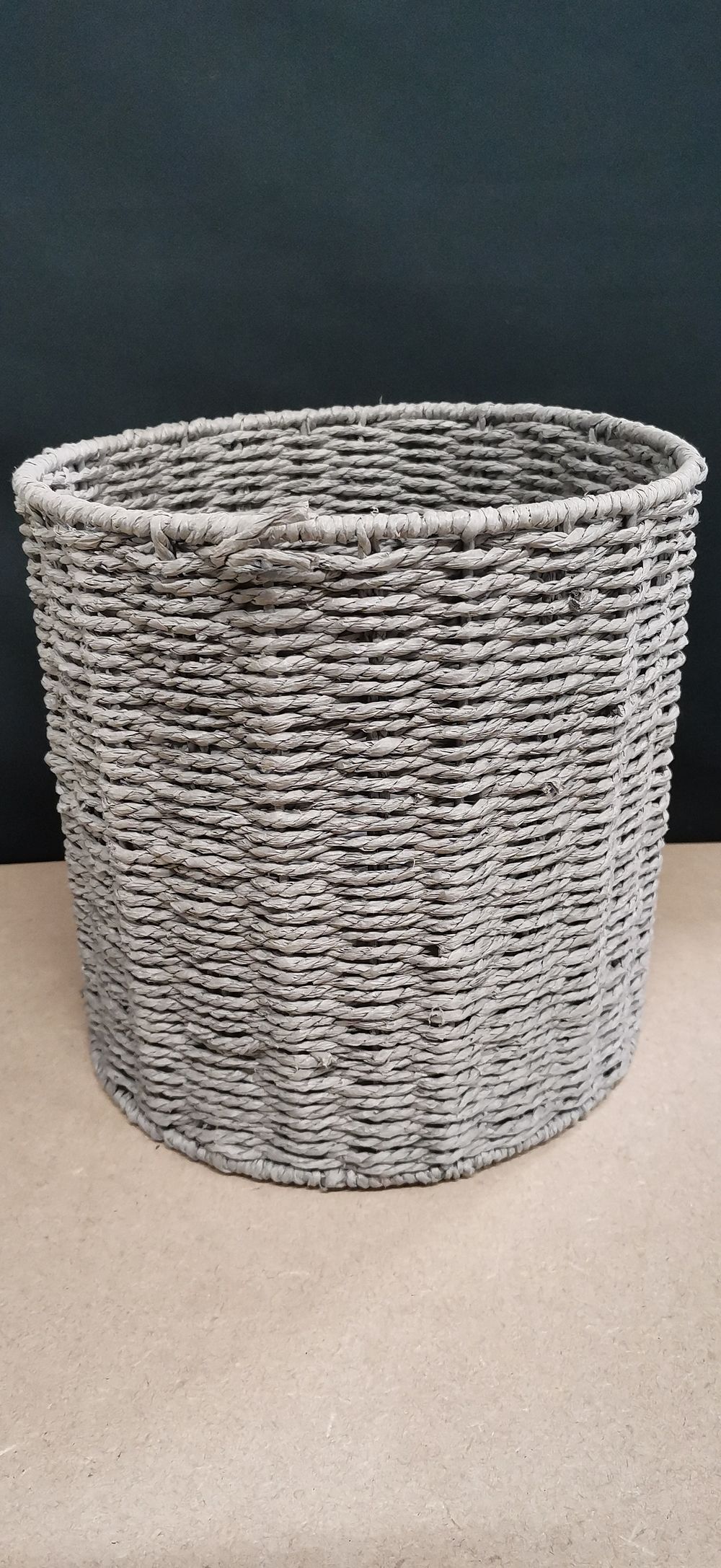 Lot 219: A Grey Cylindrical Woven Basket