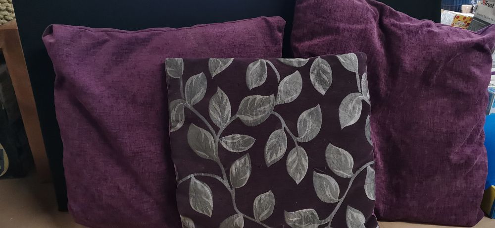 Lot 231: A Trio of Decorative Purple Throw Pillows