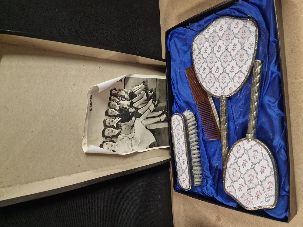 Lot 248: A Collection of Silver Toned Floral Patterned Vanity Items