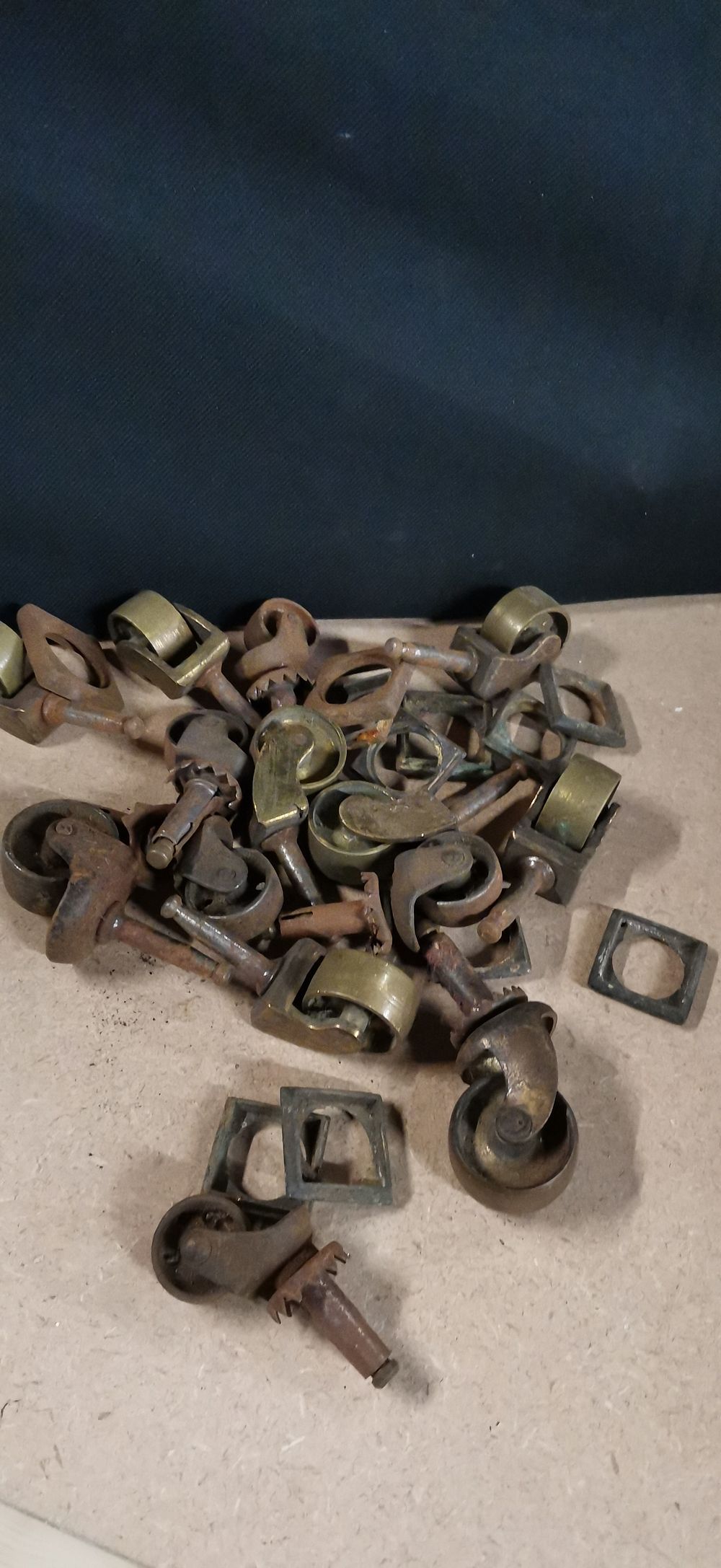 Lot 251: A Collection of Vintage Metal Furniture Casters and Plates