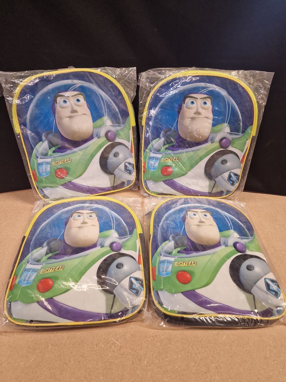 Lot 378: x4 Disney Toy Story Buzz Lightyear Mini Backpacks