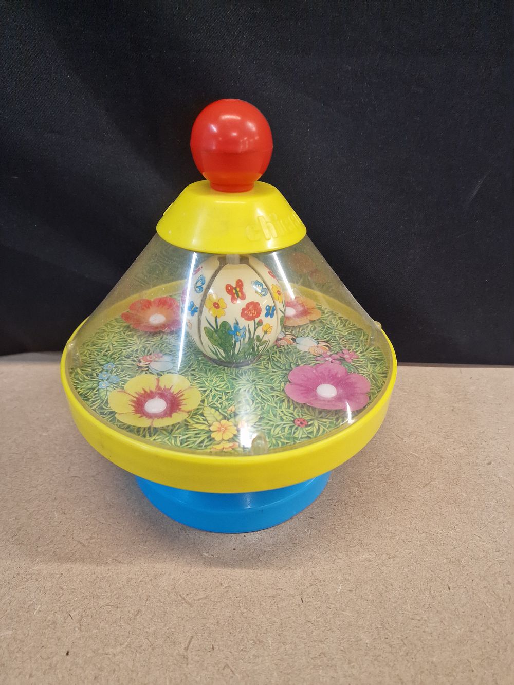 Lot 390: Vintage Chicco Floral and Bee Spinning Top Toy