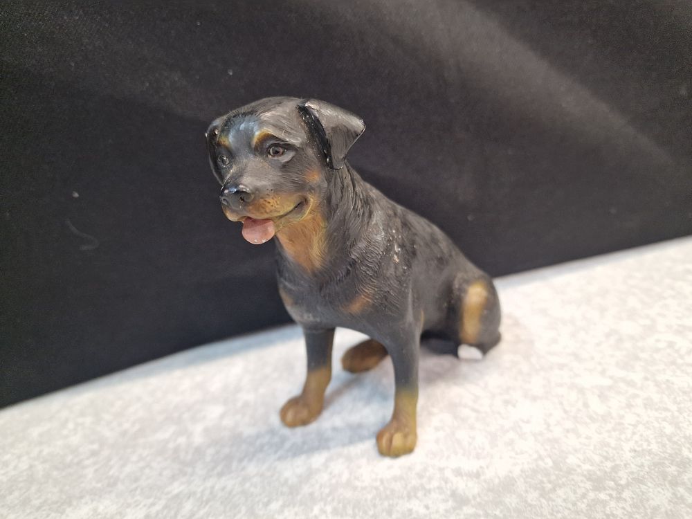 Lot 393: Sitting Rottweiler dog figurine with black and tan markings