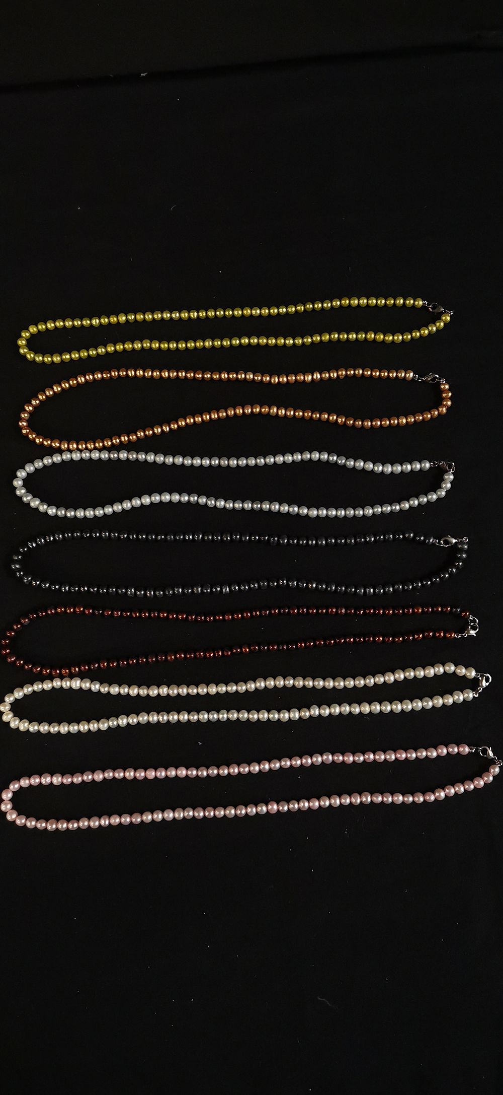 Lot 164: A Collection of Multi-Coloured Pearl Necklaces