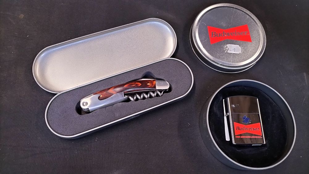 Lot 215: Two items comprising a Budweiser lighter and sommelier multi-tool
