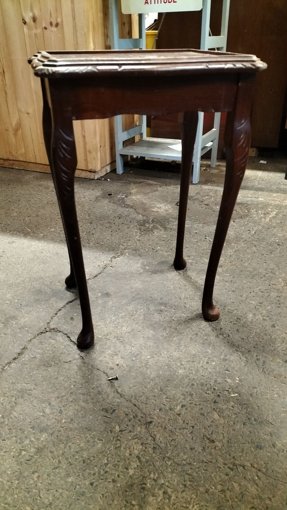 Lot 235: Vintage wooden side table with carved leaf accents