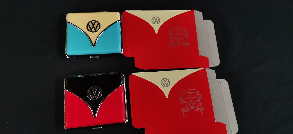 Lot 309: A Pair of Volkswagen Licensed Metal Cigarette Cases