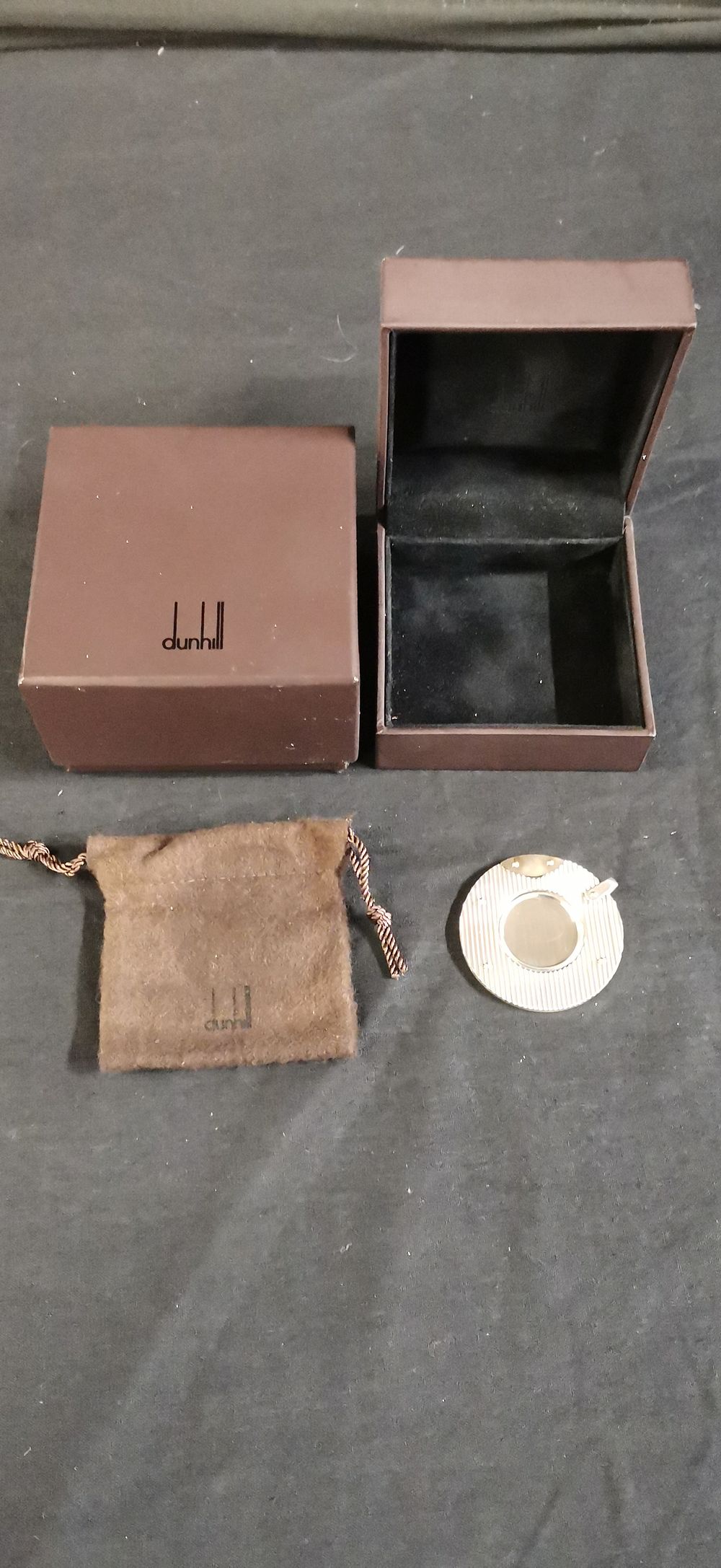 Lot 313: A Dunhill Silver Toned Circular Cigar Cutter with Packaging