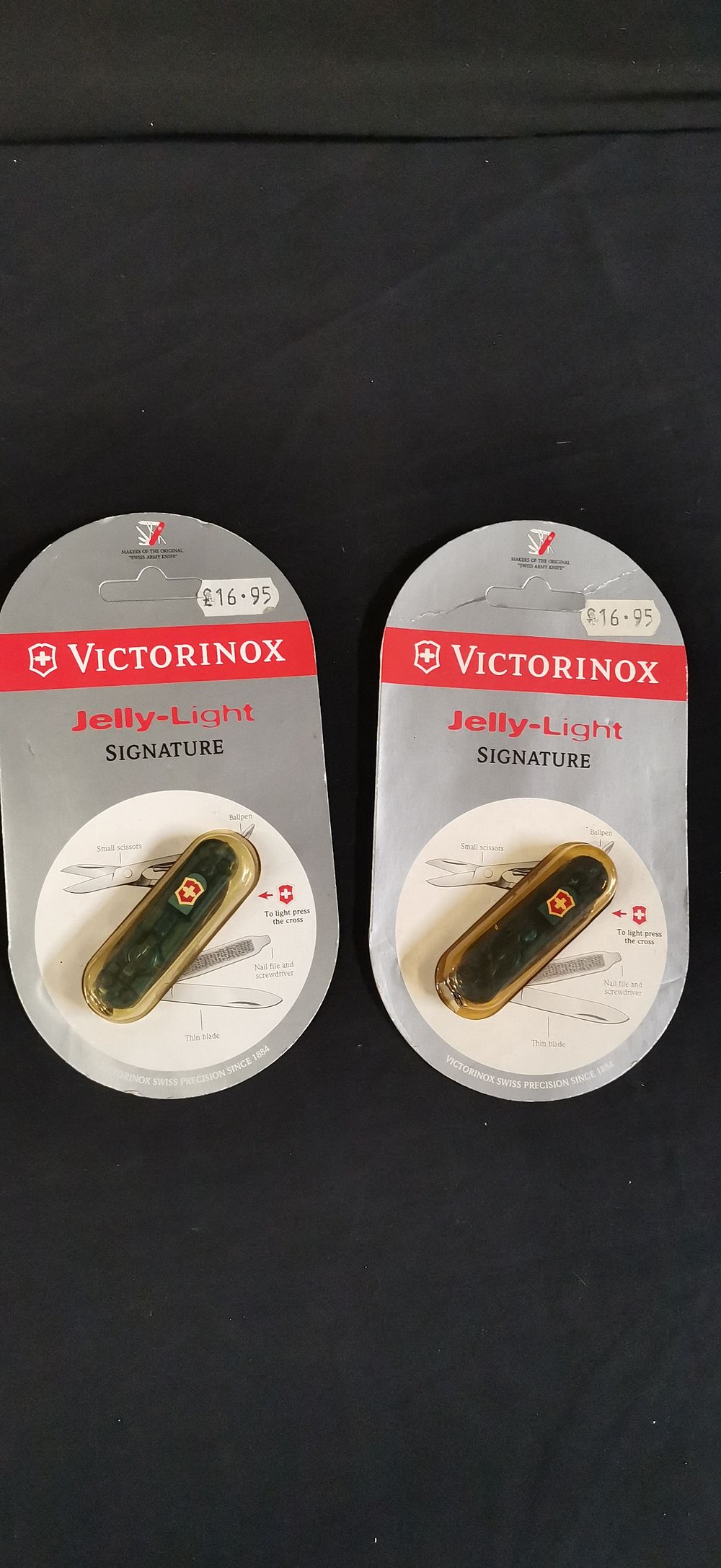 Lot 328: A Pair of Victorinox Jelly-Light Signature Pocket Knives. RRP £16.95 each