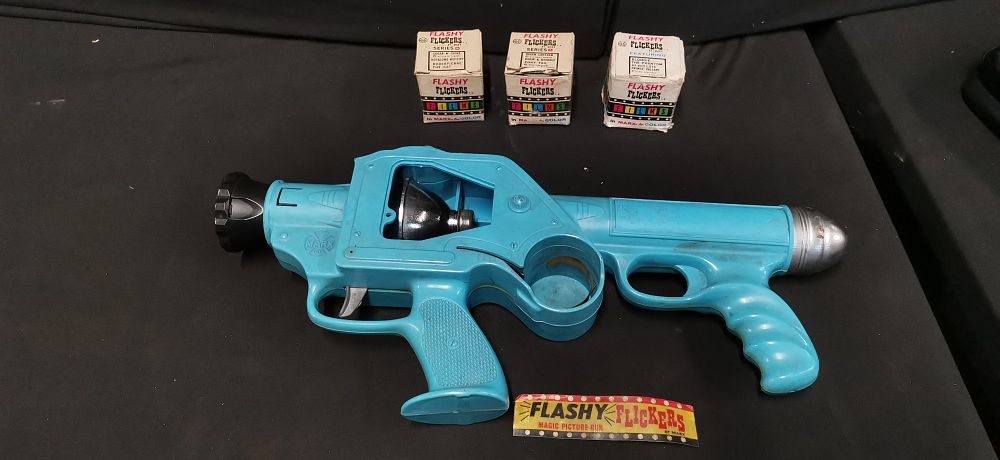 Lot 361: Marx Toys Flashy Flickers Magic Picture Gun and Three Films