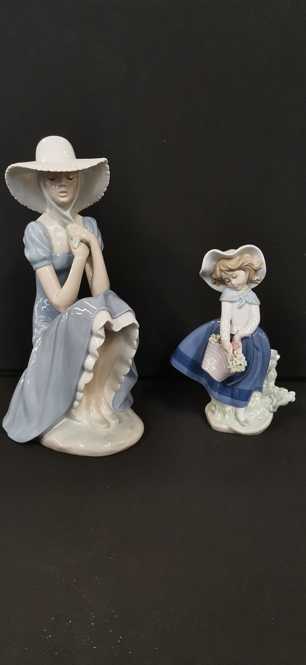 Lot 277: A Pair of Lladro and Nao Porcelain Girl Figurines